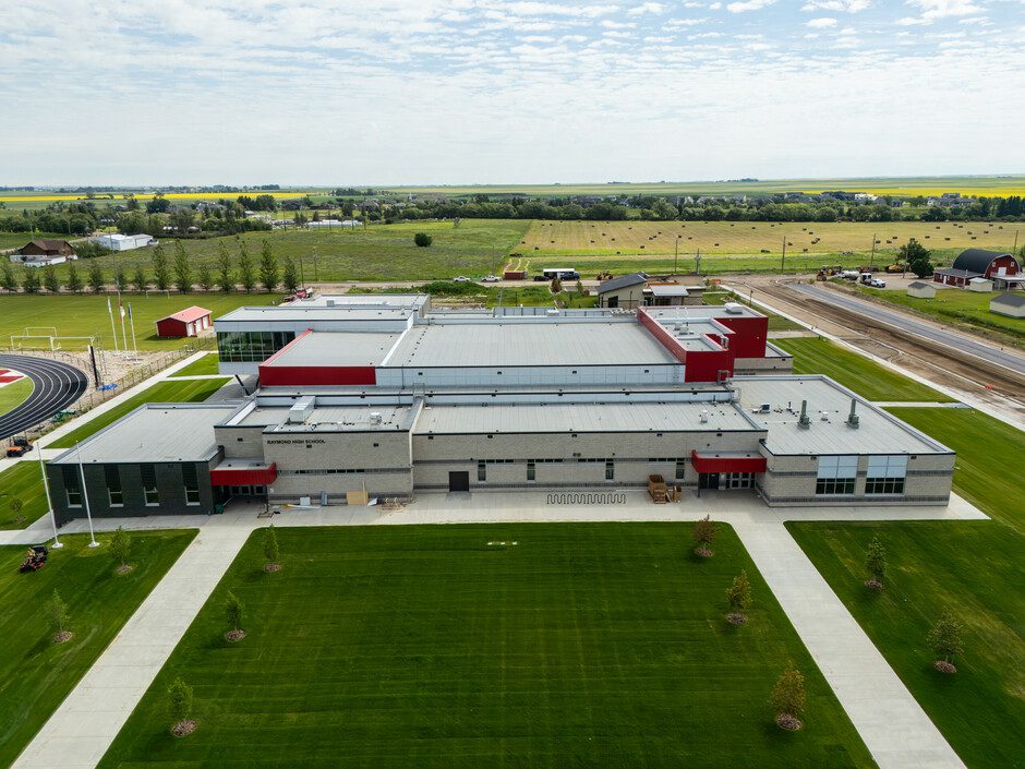 Aerial view of the new Raymond High School campus beside Victoria Park in Raymond, Alberta